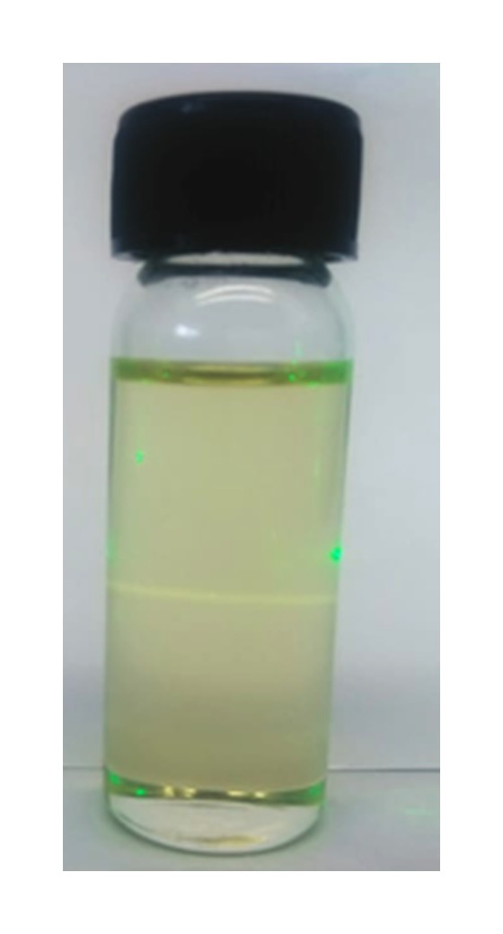 Glass vial containing the base system with a laser beam passing through it, showing minimal light scattering